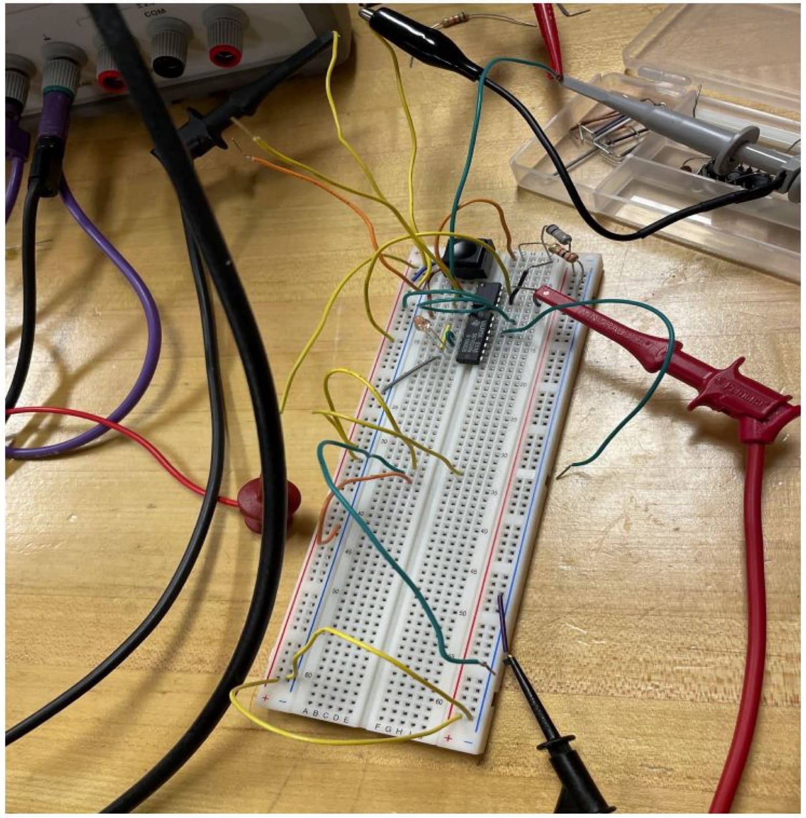 Breadboard with the 741, scope probes and the phone cable
