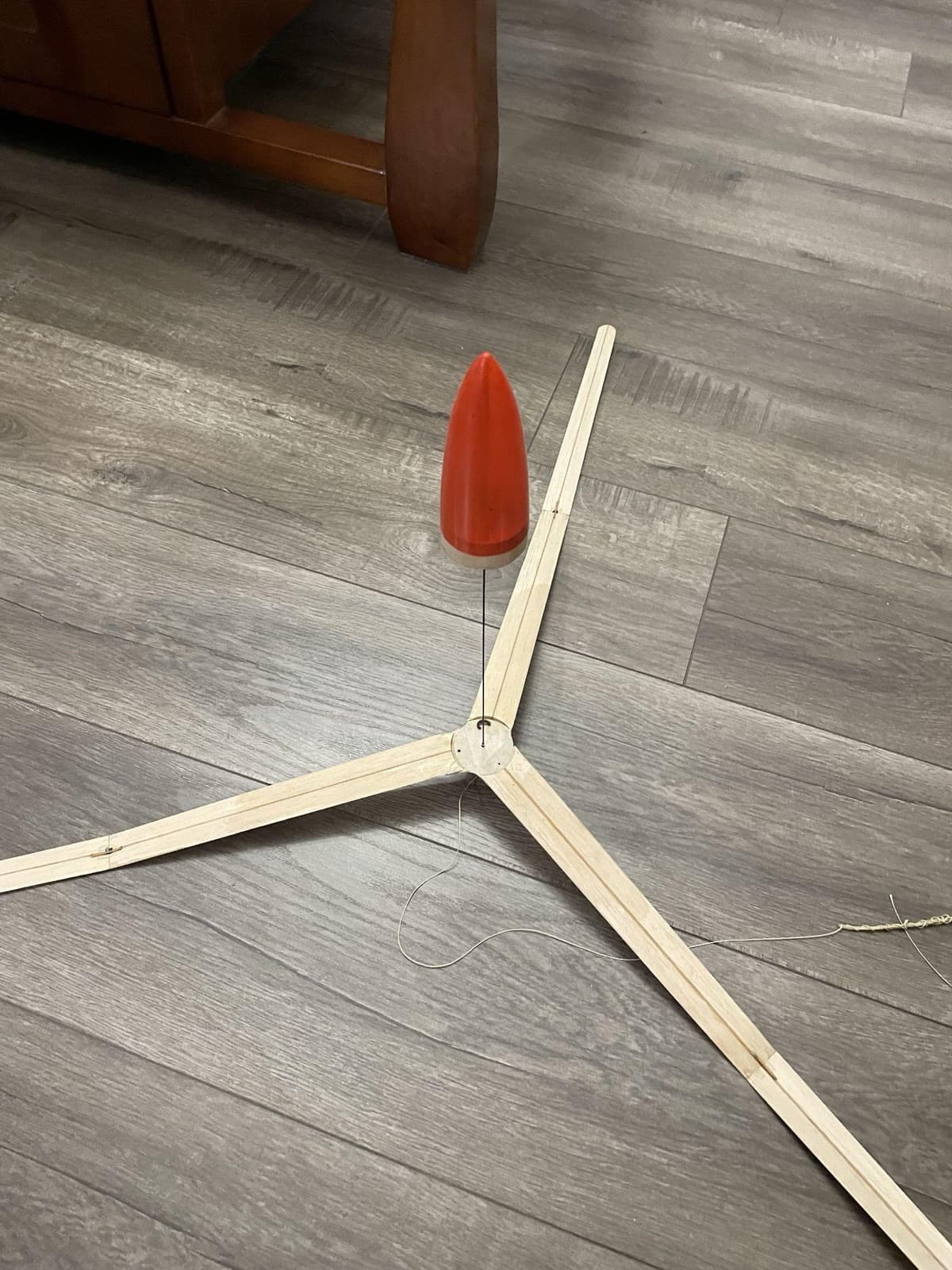Three-fin rocket on the floor